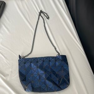 Navy blue shoulder bag.